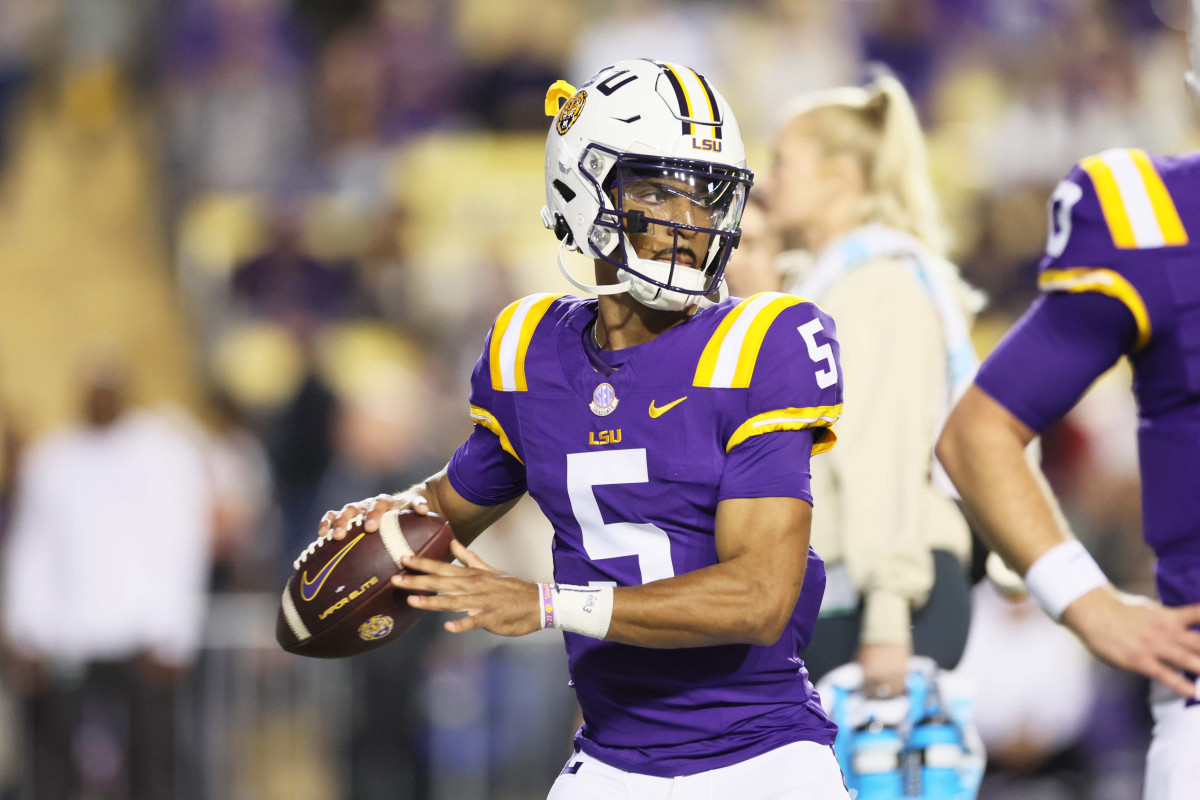 Nov 18, 2023; Baton Rouge, Louisiana, USA; Heisman Trophy candidate LSU Tigers quarterback Jayden Daniels (5) warms up before their game against the Georgia State Panthers at Tiger Stadium.